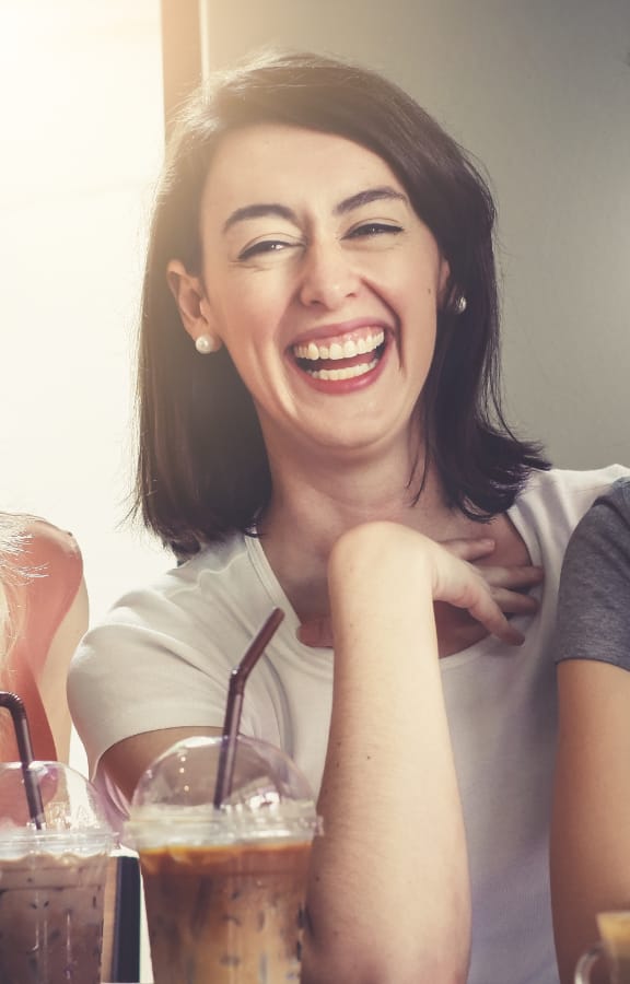 Group of three woman laughing with each other