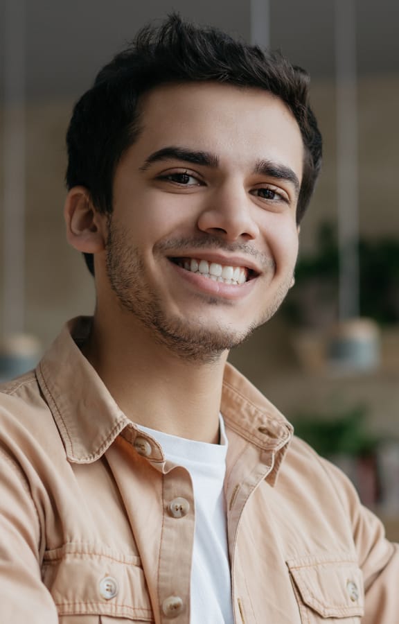 Young man sitting at a coffee shop