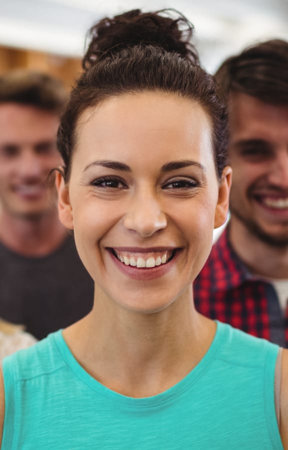 Group of people standing in an office