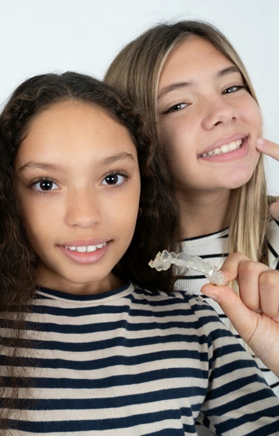 Group of teens showing off their straight teeth