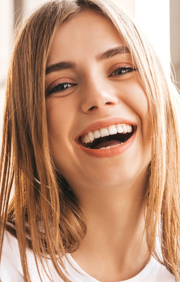 Woman outside laughing