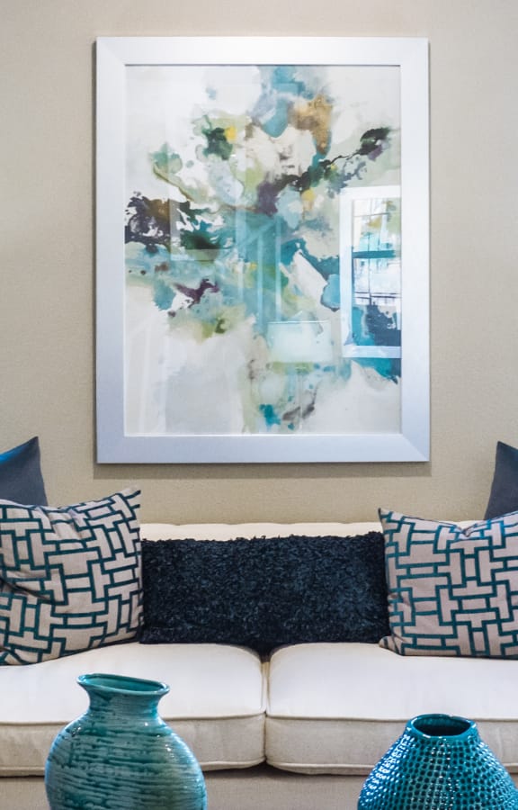 A couch and table in a nicely decorated living room
