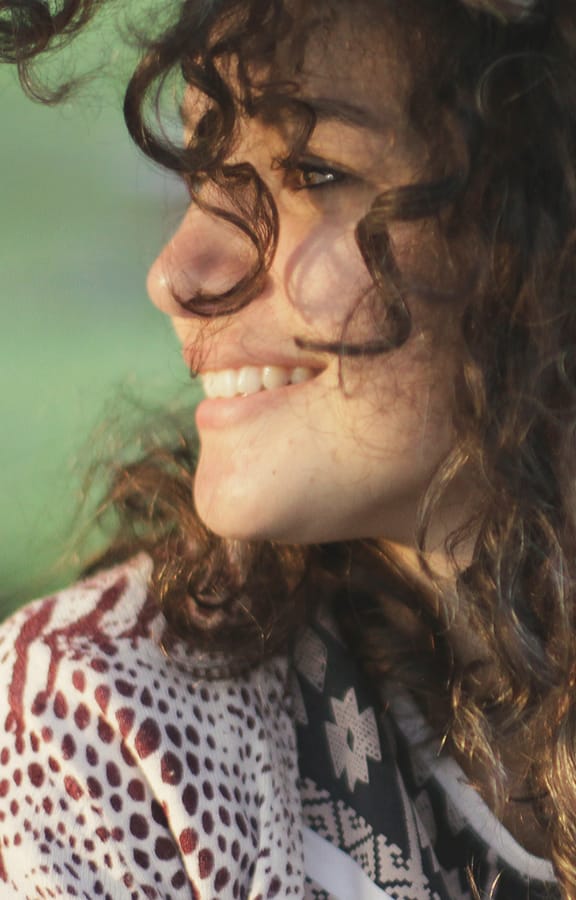 Young woman looking over her right shoulder